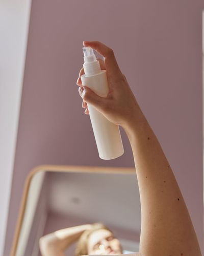 A person integrating gentle movement into their daily home routine.